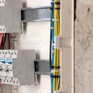Voltage switchboard with circuit breakers are in the ON and OF positions in the big electric box for electrical distribution panel and temporary electric cables are switched. Electrical background.